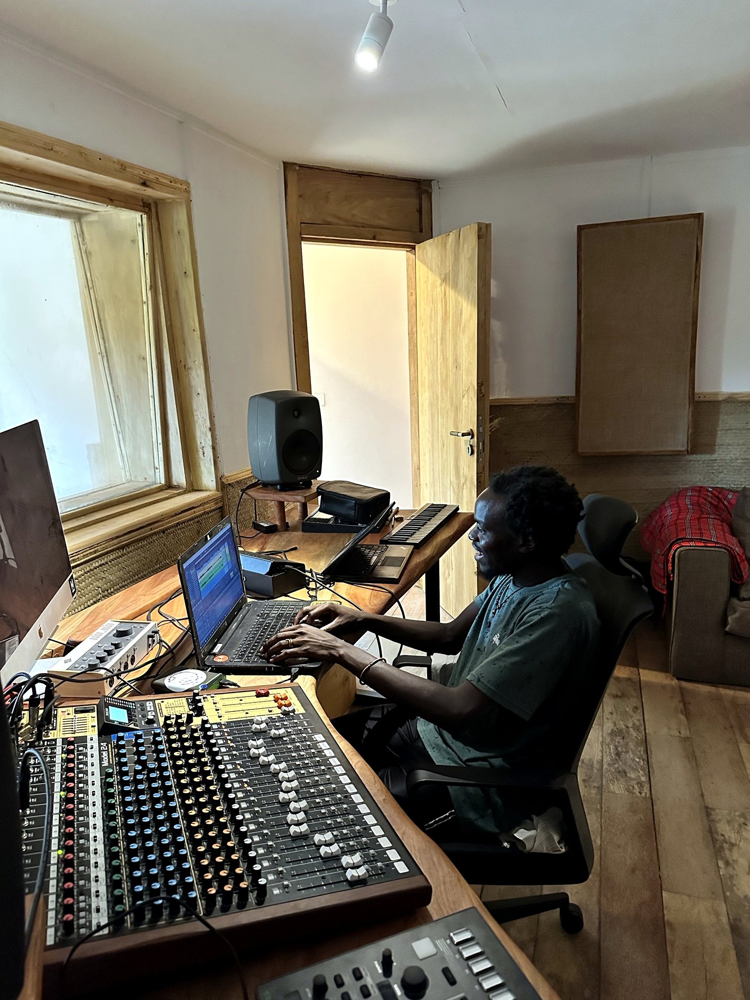 An engineer working at the mixing desk in Baobab Studio